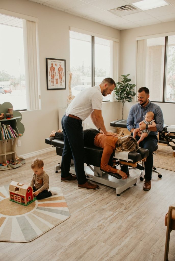 Family receiving traditional chiropractic care together at a wellness clinic in Allen, TX